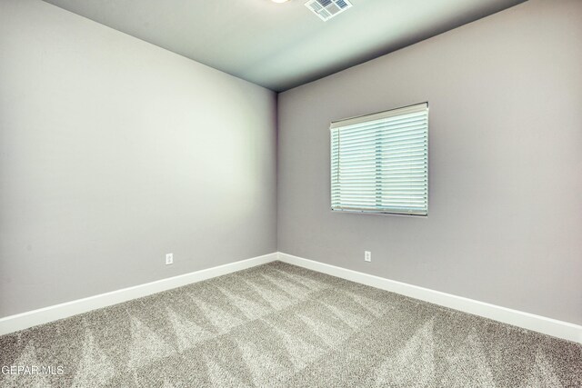 empty room featuring carpet floors