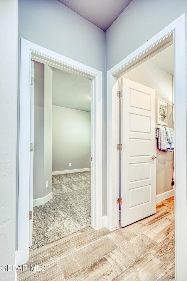 hallway featuring wood-type flooring