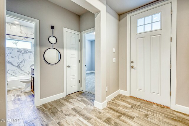 entryway with light hardwood / wood-style flooring