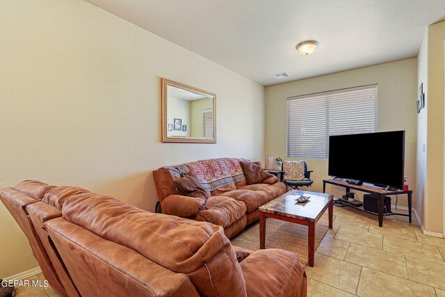 living room with light tile patterned flooring