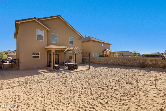 rear view of property with a patio area