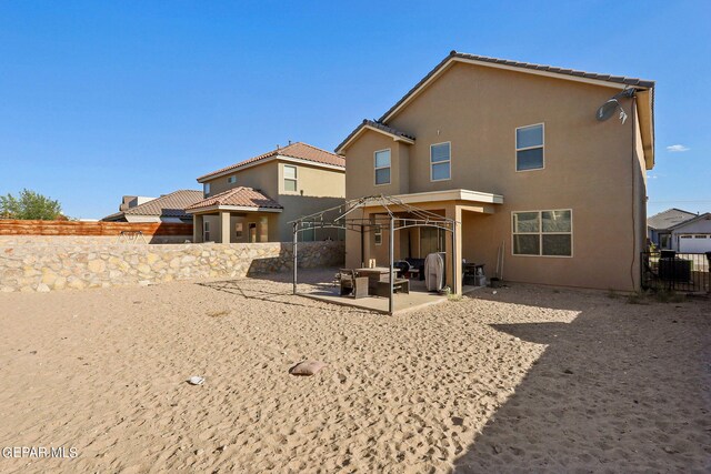 rear view of property with a patio