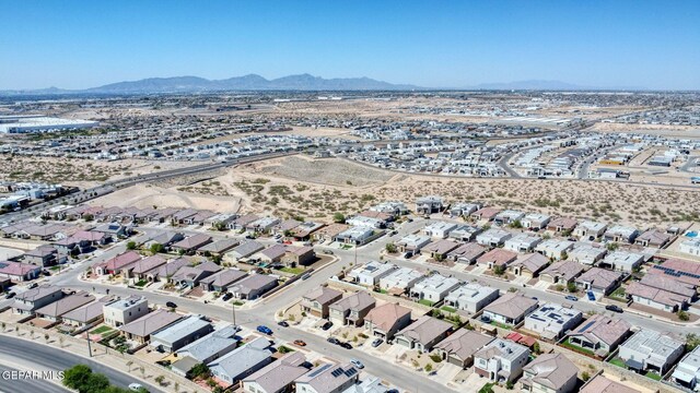 birds eye view of property with a mountain view