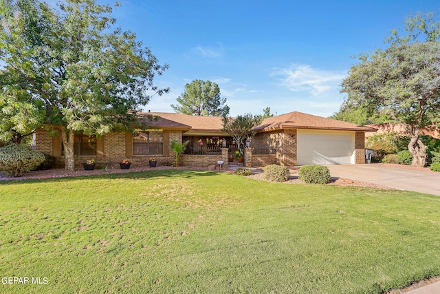 ranch-style home featuring a garage and a front lawn