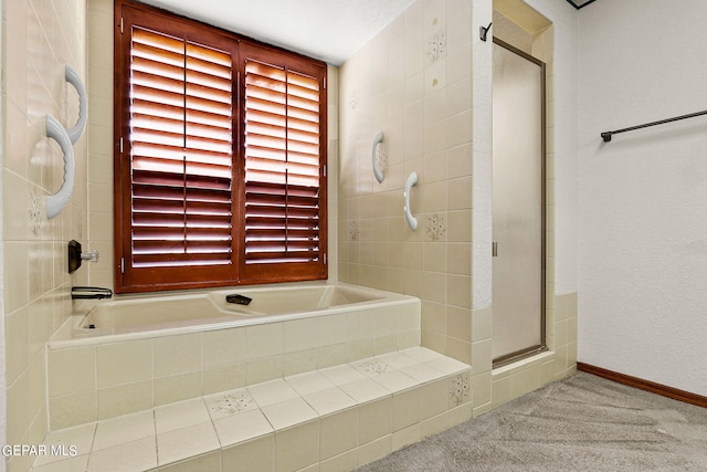 bathroom featuring separate shower and tub