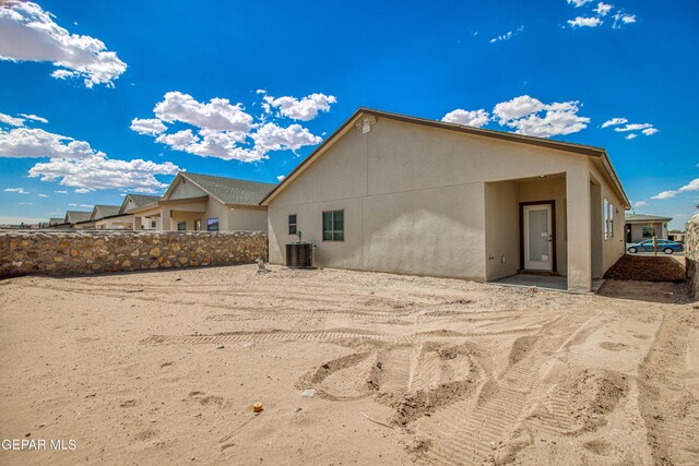 back of property with central AC unit