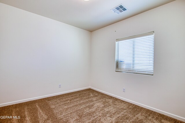 view of carpeted spare room