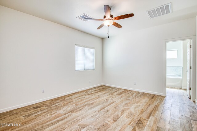 empty room with light hardwood / wood-style floors and ceiling fan