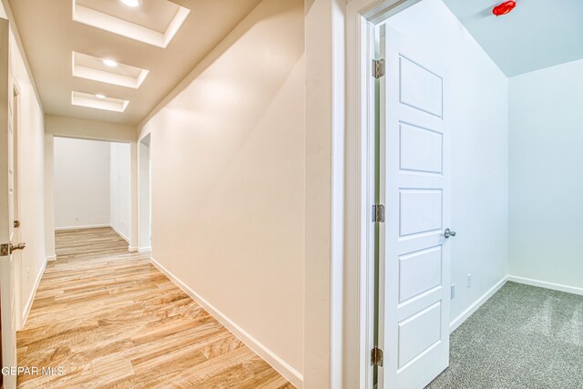 hall with light hardwood / wood-style floors