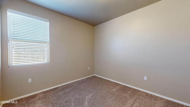 empty room with carpet flooring