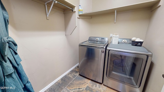 washroom featuring washer and dryer