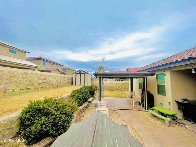 view of patio featuring a storage unit