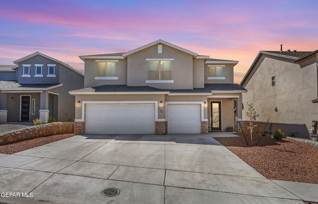 view of front of property with a garage