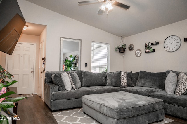 living room featuring lofted ceiling, ceiling fan, and dark hardwood / wood-style floors