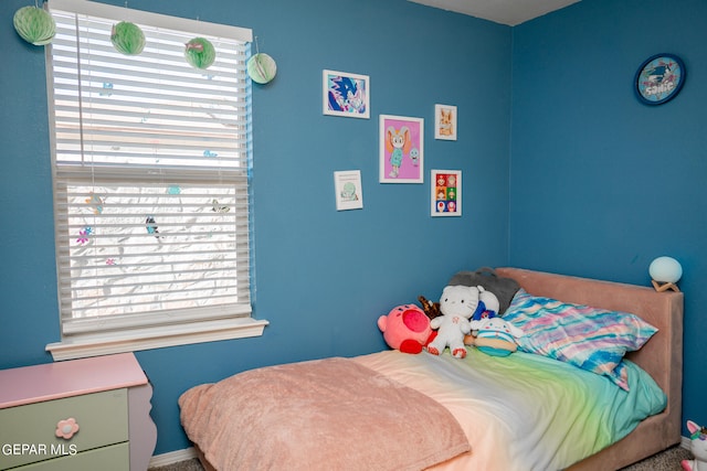 bedroom featuring multiple windows