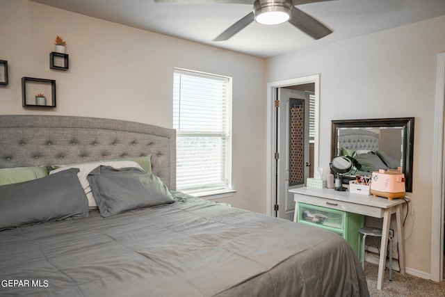 bedroom featuring ceiling fan and light colored carpet