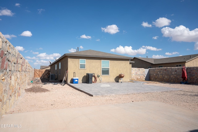 back of house with a patio