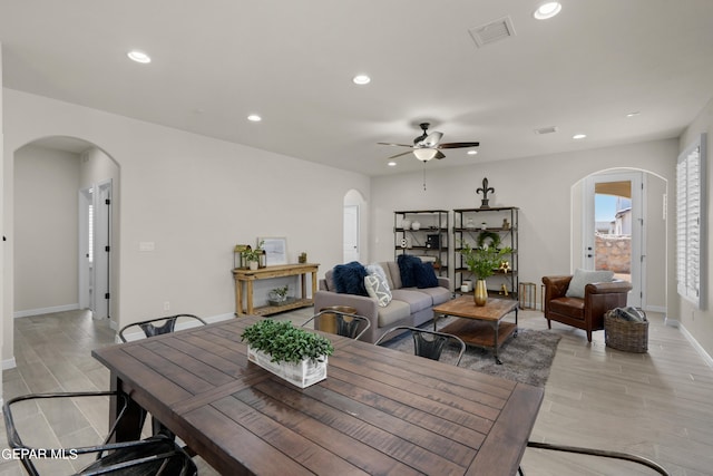 dining space with light hardwood / wood-style floors and ceiling fan