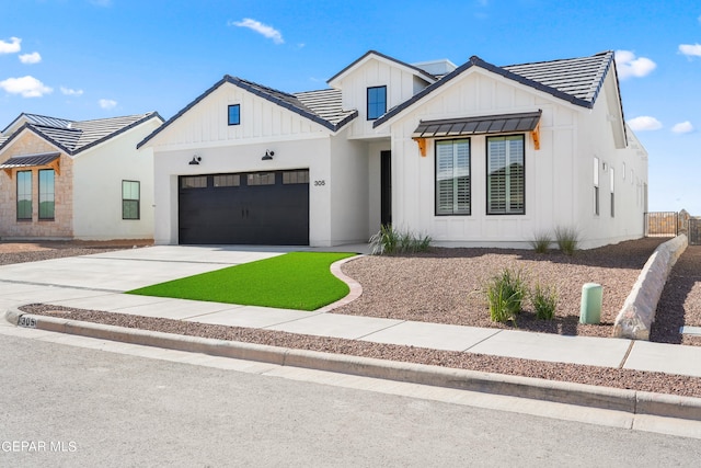 modern farmhouse style home with a garage