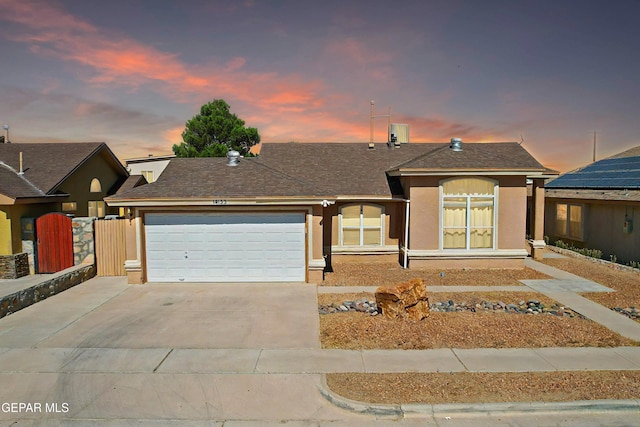 single story home with a garage