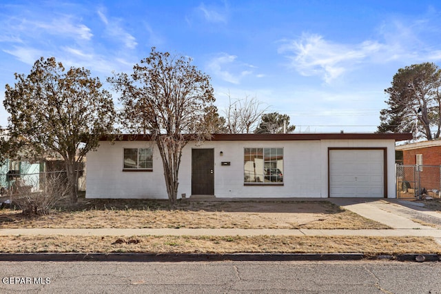 ranch-style house featuring a garage