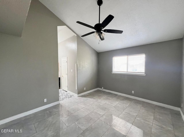 unfurnished room with ceiling fan, a textured ceiling, and vaulted ceiling