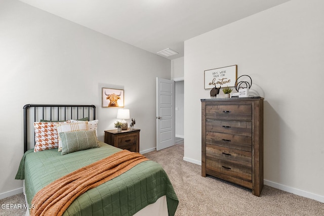 bedroom featuring light carpet, visible vents, and baseboards