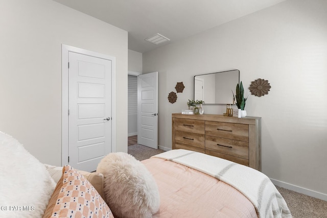 bedroom featuring carpet and baseboards