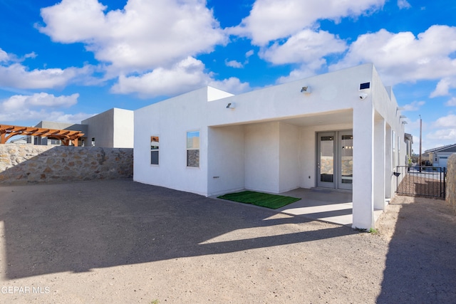 rear view of house with a patio