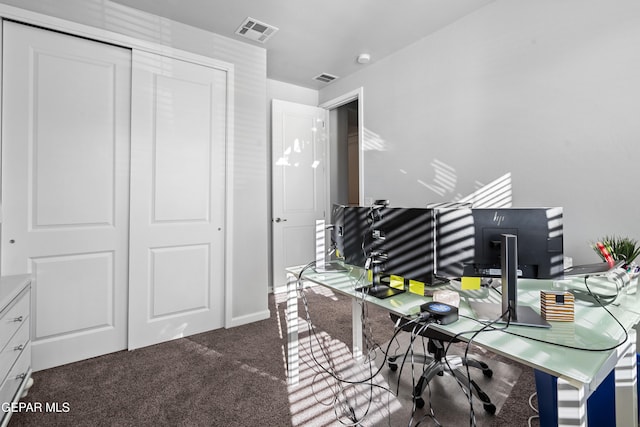 office space with dark colored carpet