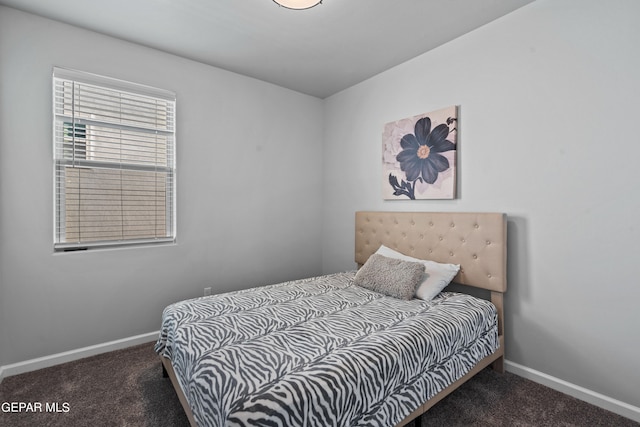 bedroom featuring dark colored carpet