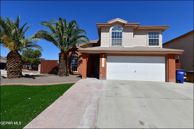 view of front of home with a garage and a front yard