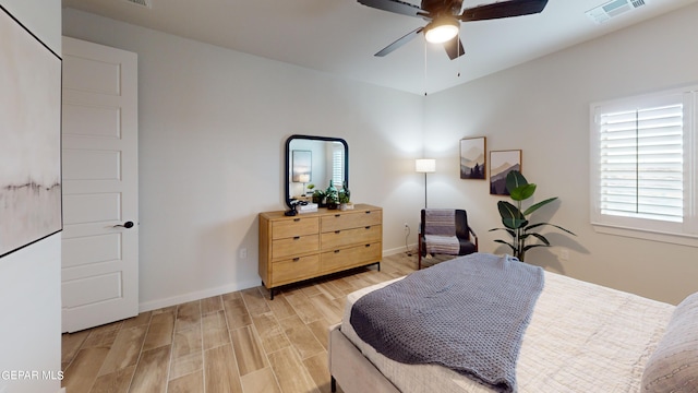 bedroom with ceiling fan and light wood-type flooring