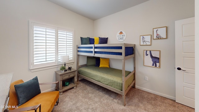 bedroom featuring light colored carpet