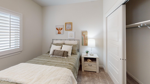 carpeted bedroom featuring a closet