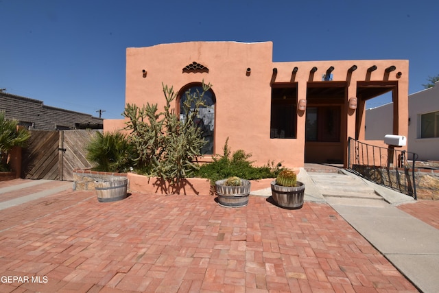 southwest-style home with a patio