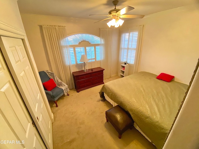 carpeted bedroom featuring ceiling fan