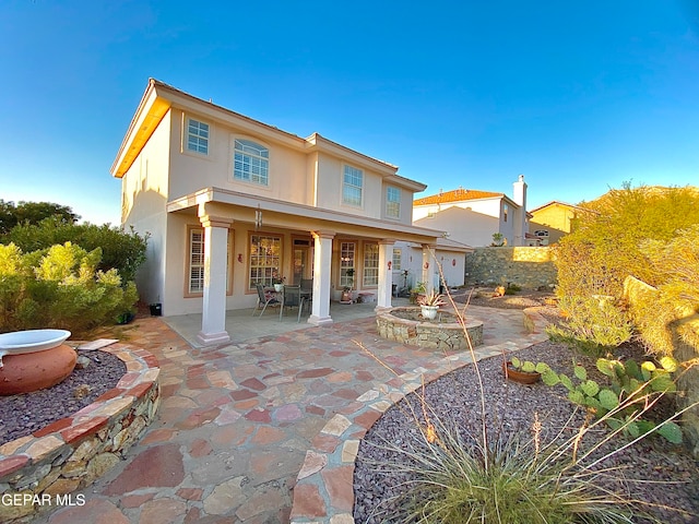 rear view of property with a patio