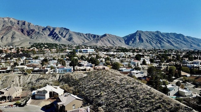 birds eye view of property featuring a mountain view