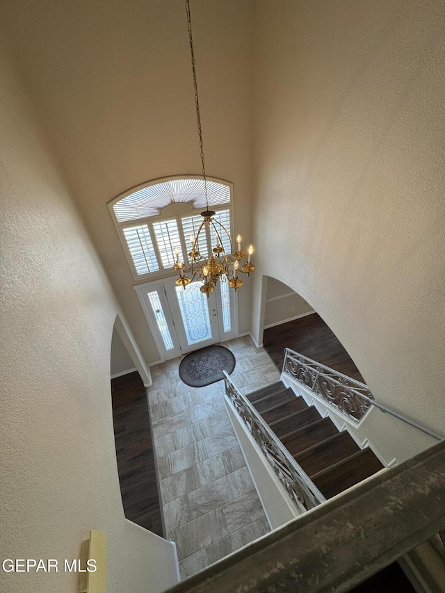 6276 Los Bancos Dr, El Paso, TX 79912 - foyer entrance featuring a chandelier, a high ceiling, and french doors