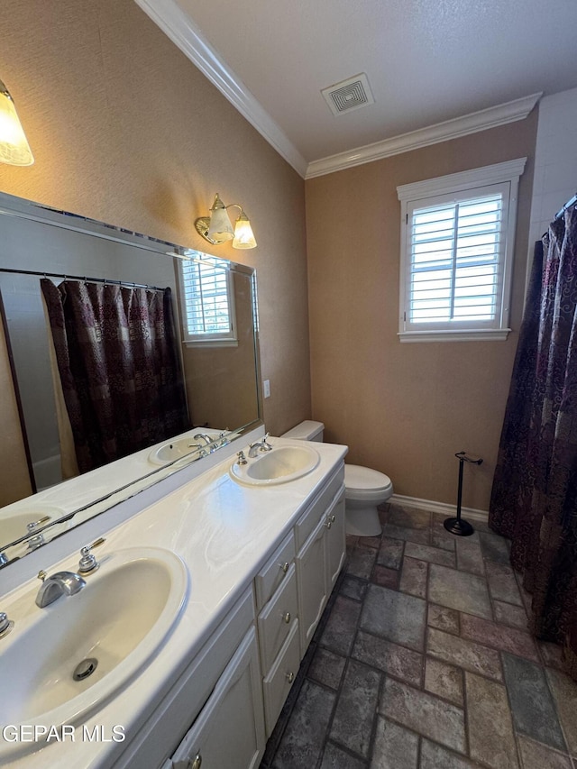 6276 Los Bancos Dr, El Paso, TX 79912 - bathroom with crown molding, double vanity, plenty of natural light, and curtained shower