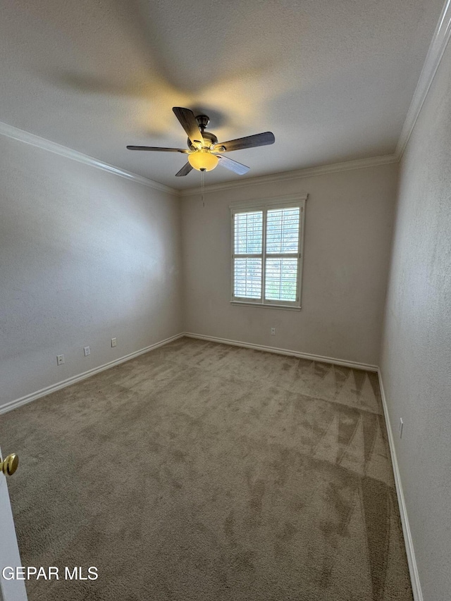 6276 Los Bancos Dr, El Paso, TX 79912 - unfurnished room with ornamental molding, carpet floors, and ceiling fan