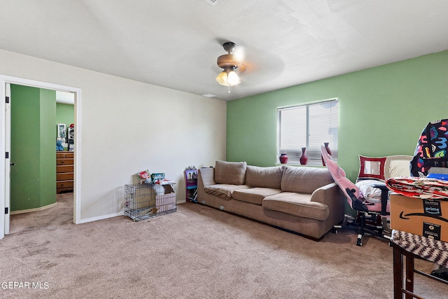 carpeted living room with ceiling fan