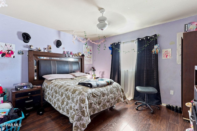 bedroom featuring a ceiling fan and wood finished floors