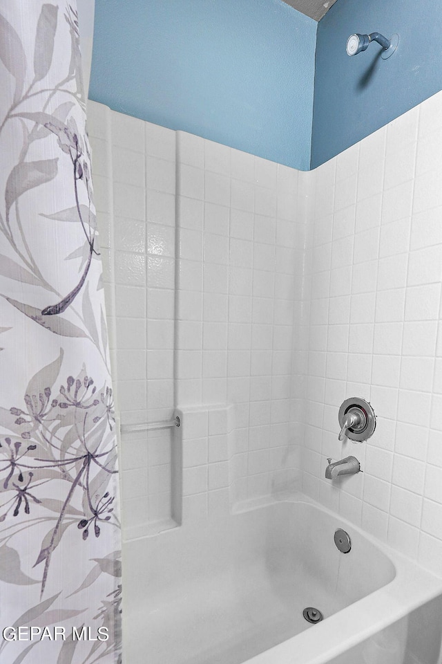 full bathroom with shower / tub combo