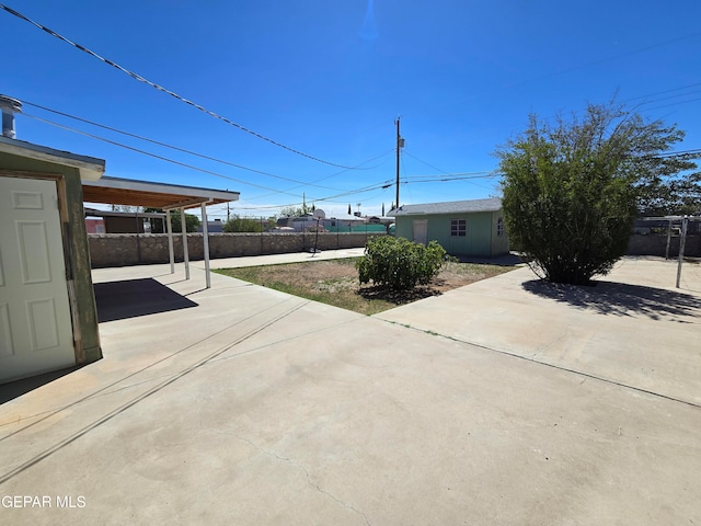 exterior space featuring a carport