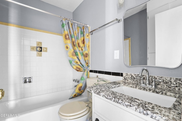 full bathroom with shower / bath combination with curtain, vanity, and toilet