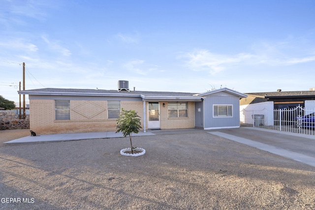 ranch-style house featuring central AC unit