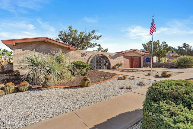 ranch-style home featuring a garage