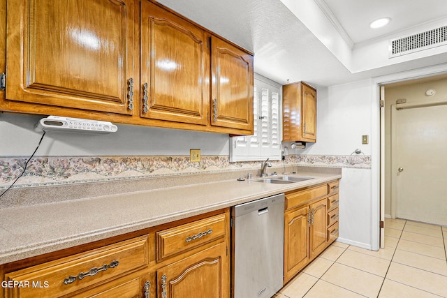 kitchen featuring stainless steel dishwasher, light tile patterned flooring, crown molding, and sink